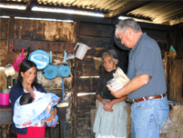 Home_bound_grandmother_receives_a_food_packet